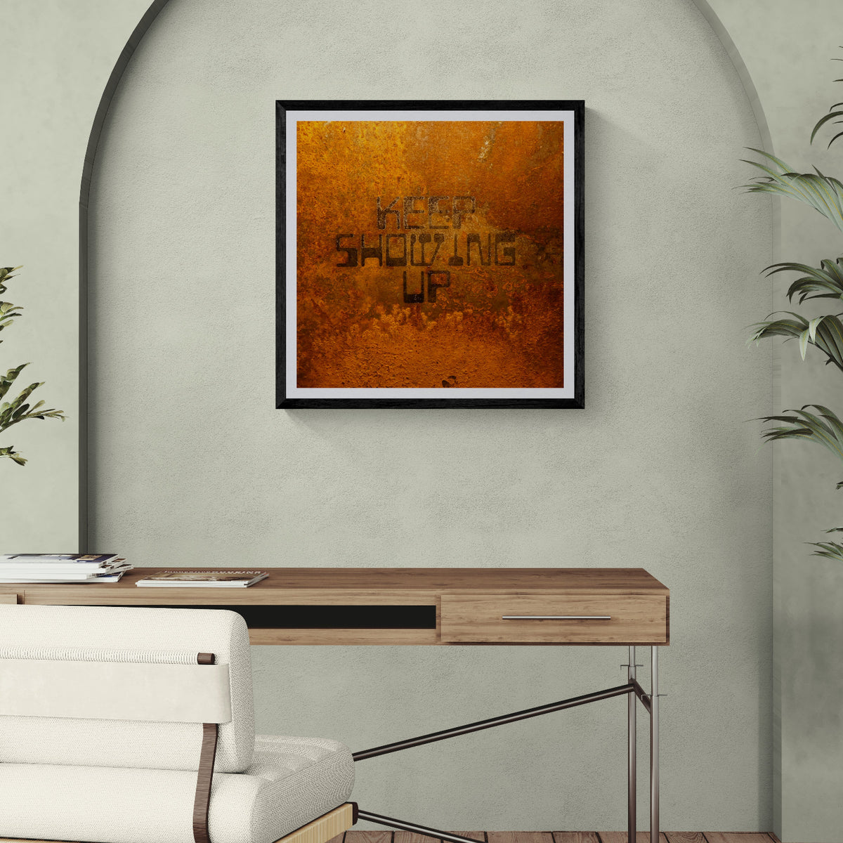 Keep Showing Up rust texture typography art print displayed as 30 × 30 wall art in a black frame above a wood desk in a modern home office.