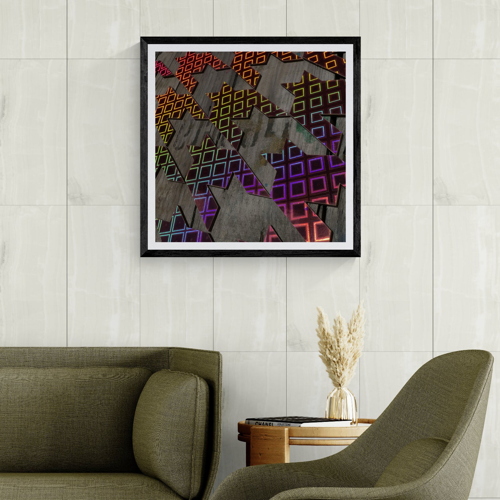 Light Work rainbow geometric photography art print displayed as 30 × 30 wall art in a black frame above olive green seating in a modern living room.
