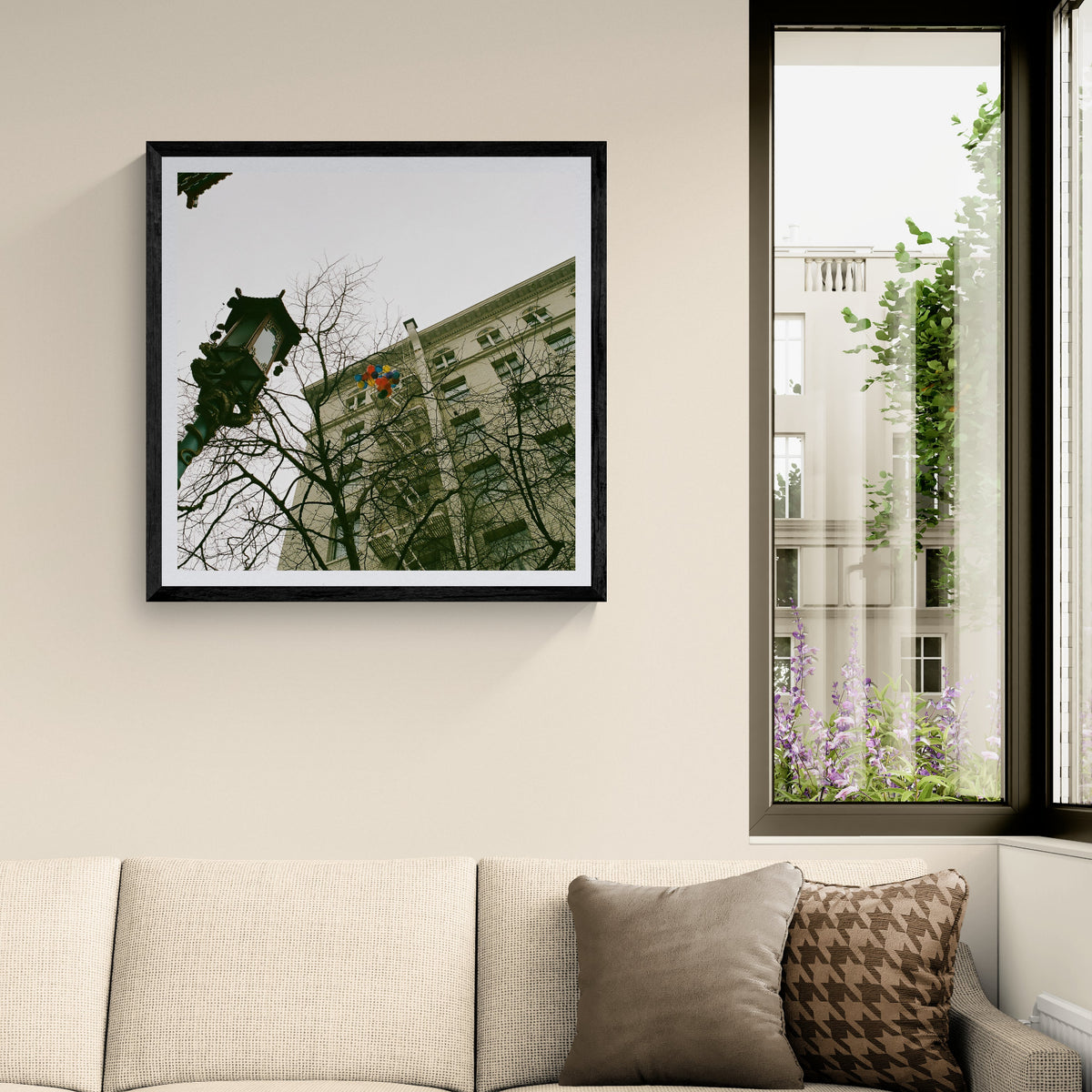 Lost Balloons urban film photography art print featuring colorful balloons caught among bare tree branches and city architecture, displayed as 30 × 30 wall art in a black frame.