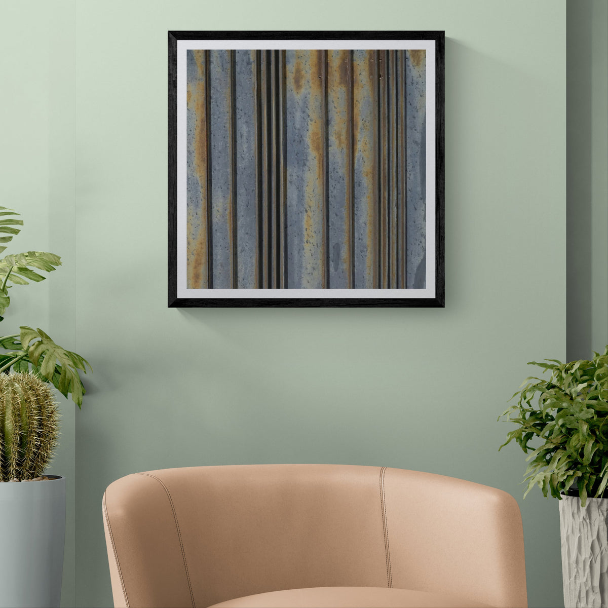 Oxide Lines abstract photograph of rusted metal lines displayed as 30 × 30 wall art in a black frame on a pale sage green wall.