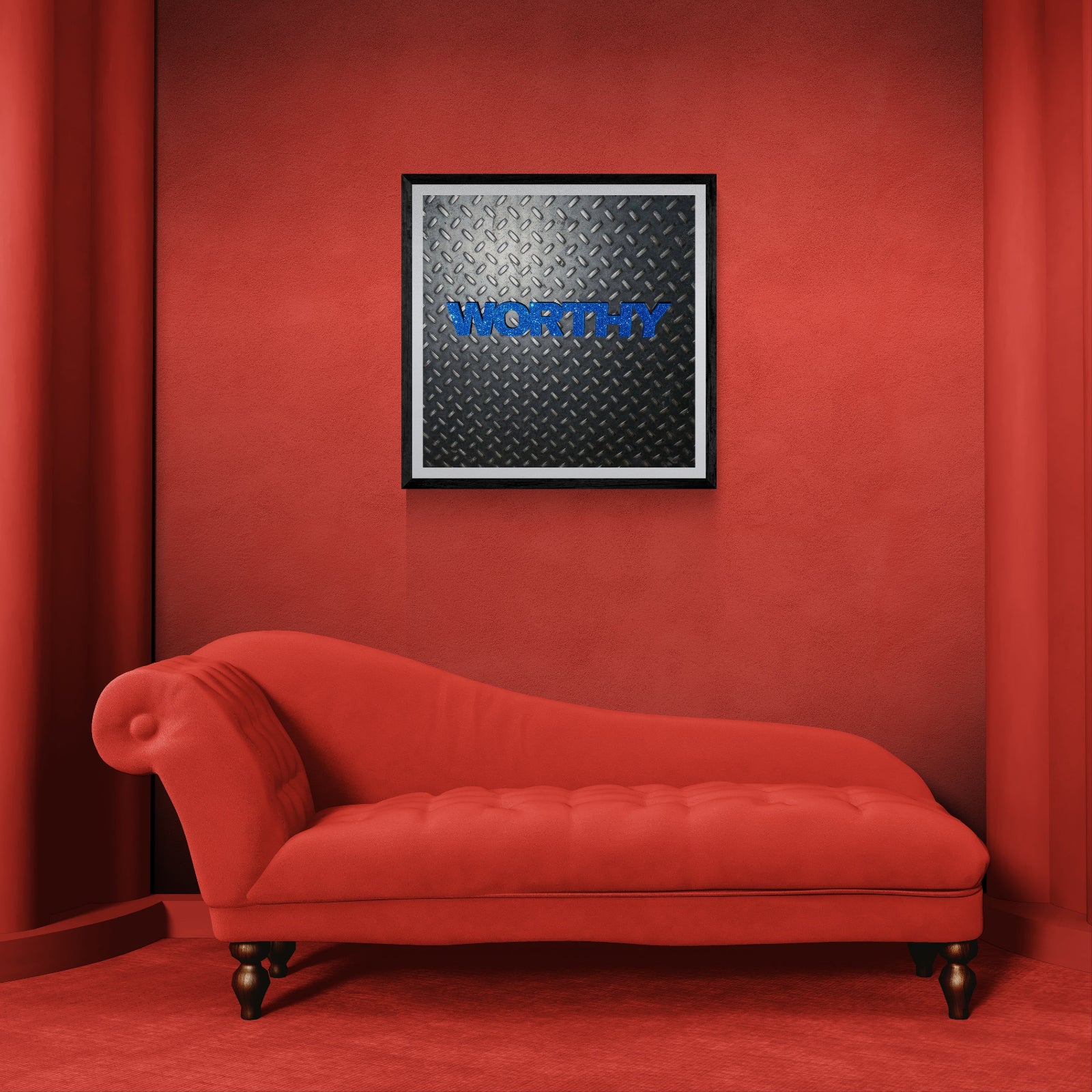 Worthy blue typography art print on diamond plate displayed as 30 × 30 wall art in a black frame above a red chaise lounge in a monochromatic red room.